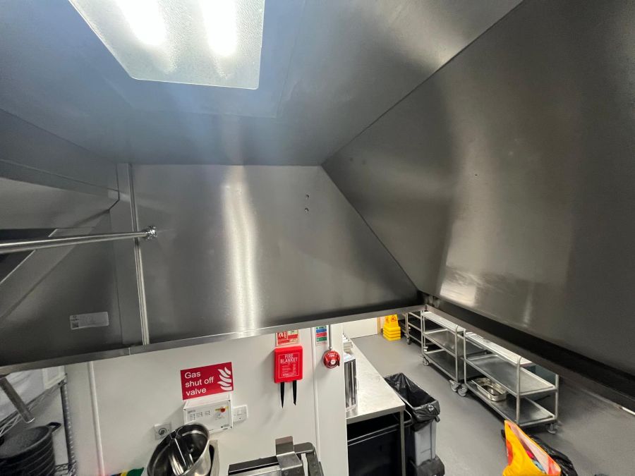 Commercial kitchen extract canopy from the historic EC Cleaners project at Barton Peveril College in Eastleigh